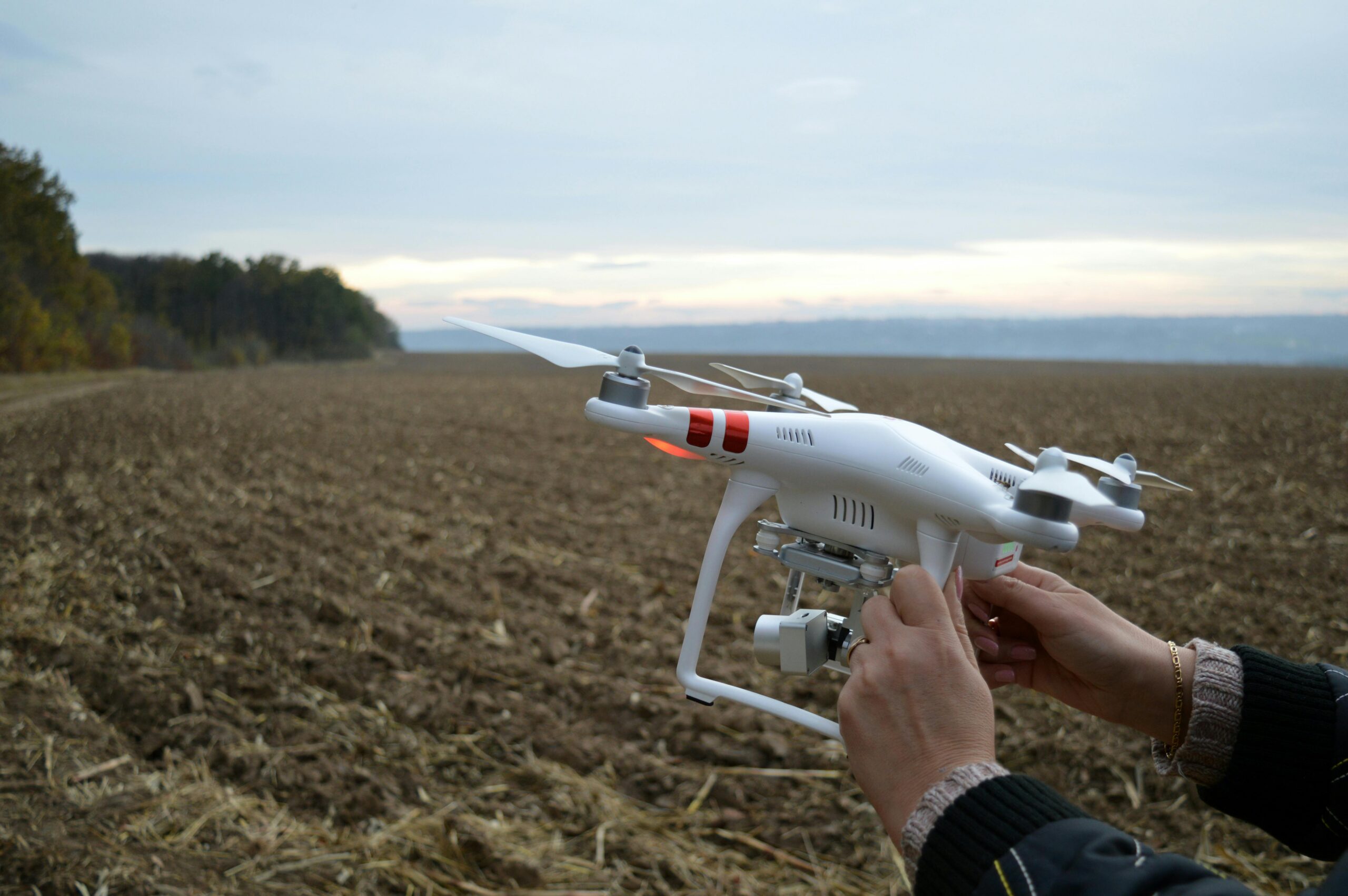 Drone preparation on a Ukrainian farm field, capturing rural landscapes and agriculture.